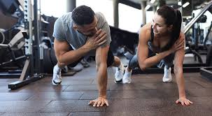 Toning Bingo Wings: Your Ultimate Guide to Sculpting Sleek Arms at the Gym 3 Fitness trainer demonstrating arm toning exercises Herne Bay