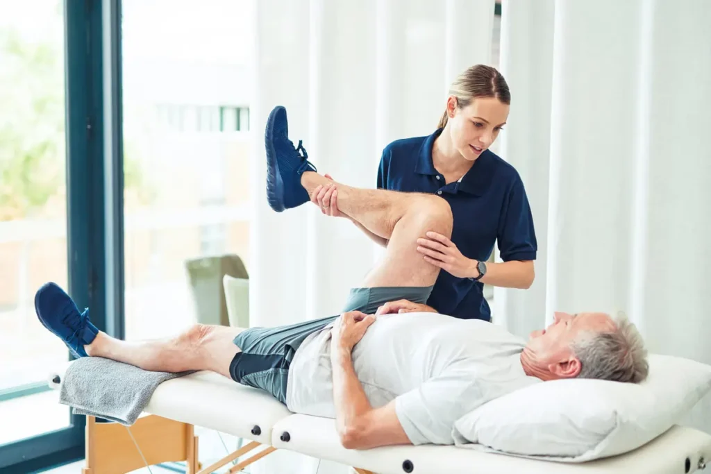 Revitalising Recovery: Effective Rehabilitation Strategies for Muscle Injuries 3 Physiotherapist assisting a patient with muscle recovery exercises Herne Bay