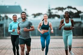 Sculpting Sleek Arms: The Essential Role of Cardio in Toning Without Bulking Up 3 image of people running to incorporate cardio Herne Bay exercise into their life to help tone arms and body.